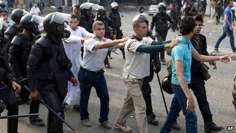 Supporters of ousted President Mohammed Morsi are detained during clashes with riot police in Cairo